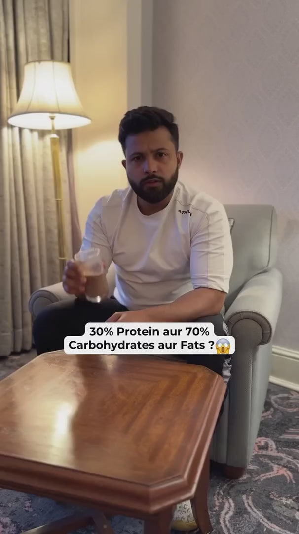 Man holding a glass of protein shake with text highlighting 30% protein vs 70% carbs and fats, emphasizing the need for high-protein supplements.